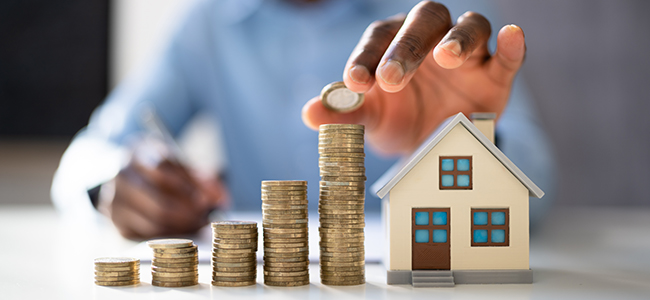 Young pensive female in eyeglasses thinking of new creative ideas